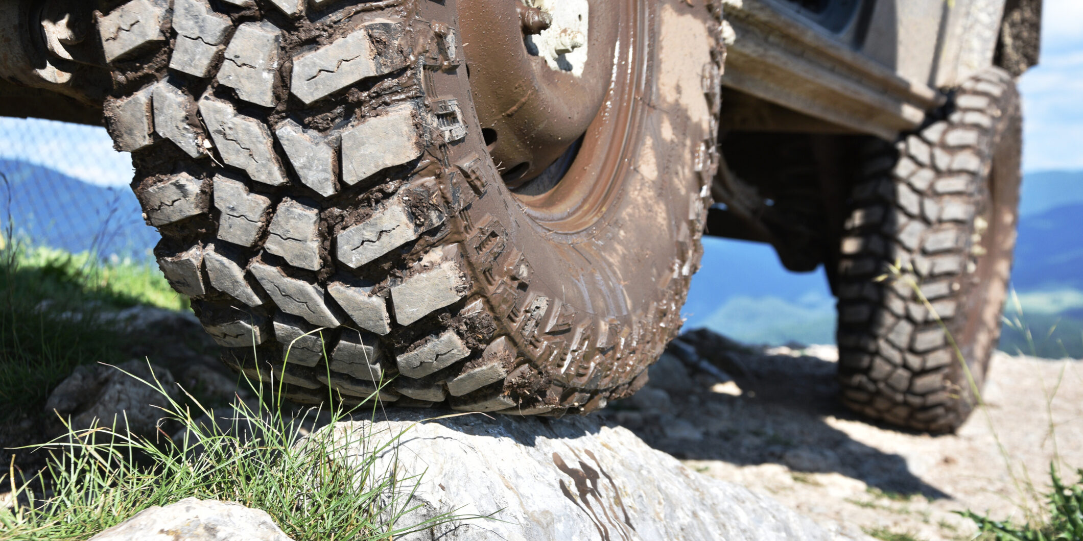 Muddy off-road vehicle tyre
