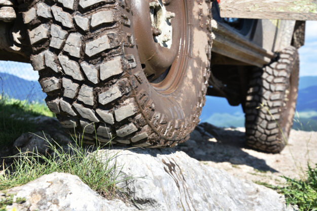 Muddy off-road vehicle tyre