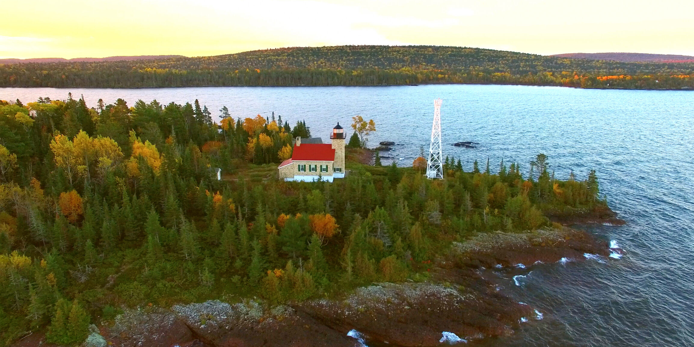 Scenic Copper Harbor Michigan lighthouse with Autumn colors, at dawn