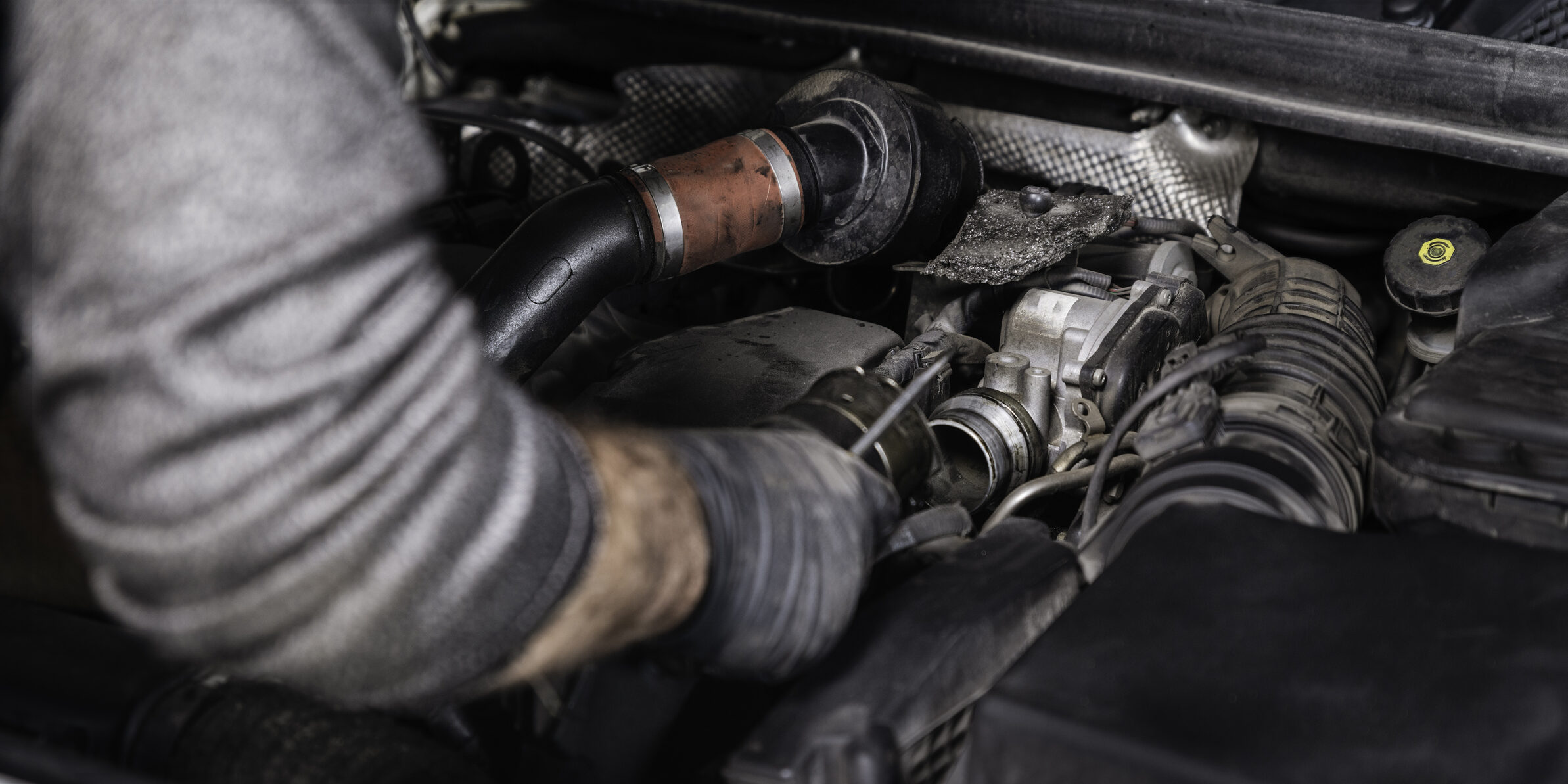 Auto Mechanic Disassembling the Machine Part in the Car
